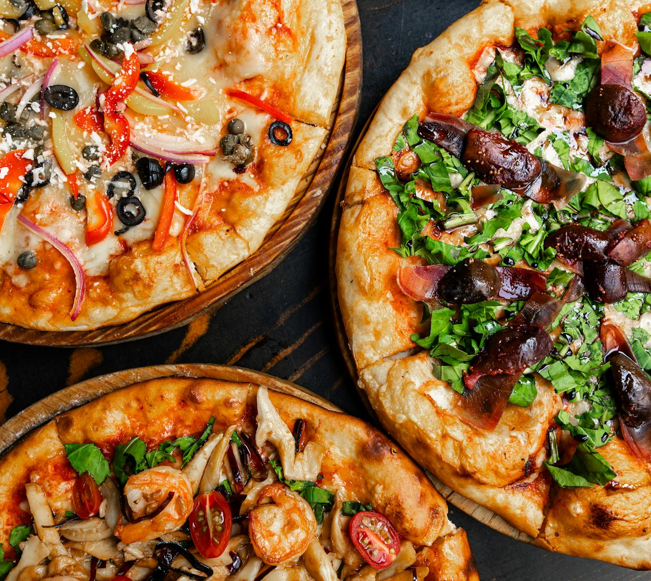 Top View of Pizzas with Different Toppings